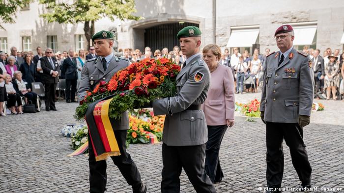 German Chancellor Angela Merkel places a wreath at Bendlerblock to commemorate 75 years since the assassination attempt on Adolf Hitler