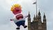 A Boris Johnson blimp flying next to the Houses of Parliament A Boris Johnson blimp flying next to the Houses of Parliament