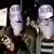 Zwei Demonstranten mit Masken vorm Gesicht, darauf die Aufschriften "NO" (Foto: ap)
