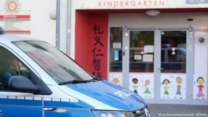 A police car parked in front a daycare center in Leipzig, Germany