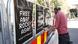 A man puts up posters in support of Rapper ASAP Rocky A man puts up posters in support of Rapper ASAP Rocky