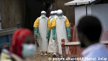 In this Tuesday, July 16, 2019 photo, health workers wearing protective gear begin their shift at an Ebola treatment center in Beni, Congo. On July 17, the World Health Organization declared the Ebola outbreak an international emergency after it spread to eastern Congo's biggest city, Goma. (AP Photo/Jerome Delay) |