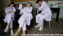 Exhausted nurses take a quick break at a hospital overflowing with injured victims of Sichuan s earthquake. May, 2008, Mianyang, Sichuan, China., Chengdu Sichuan China PUBLICATIONxINxGERxSUIxAUTxONLY Copyright: NataliexBehring 9821200005 