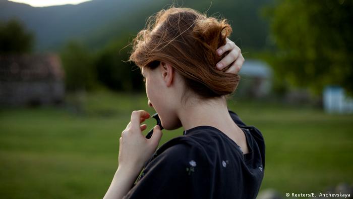 Mariam Kebadze fixes her hair (Reuters/E. Anchevskaya)