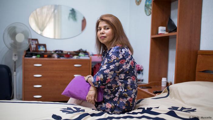 Salma poses for a portrait in her bedroom