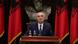 Albanian President Ilir Meta gives a speech flanked by flags Albanian President Ilir Meta gives a speech flanked by flags