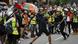Journalists film as a protester throws a brick to the Tseung Kwan O police station during an anti-extradition bill protest in Hong Kong, Sunday, Aug. 4, 2019 Journalists film as a protester throws a brick to the Tseung Kwan O police station during an anti-extradition bill protest in Hong Kong, Sunday, Aug. 4, 2019
