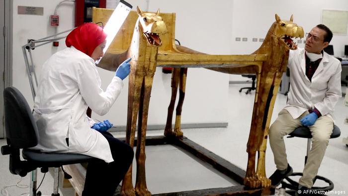 Restoration experts work on relics discovered in King Tut's tomb 