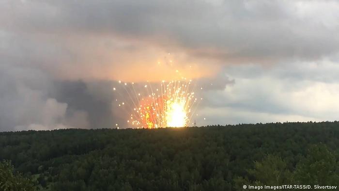 (FILE) — This photo, dated August 5, shows explosions at an ammo facility in Siberia, Russia