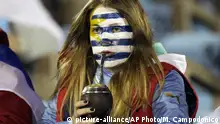 Oct. 10, 2017***
An Uruguay soccer fan sips mate before a 2018 World Cup qualifying soccer match against Bolivia in Montevideo, Uruguay, Tuesday, Oct. 10, 2017. (AP Photo/Matilde Campodonico) |