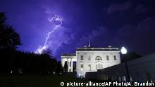 A bolt of lightning illuminates the clouds of a thunderstorm behind the White House, Tuesday, Aug. 6, 2019, in Washington. (AP Photo/Alex Brandon) |