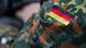 A flag patch on the shoulder of a German soldier A flag patch on the shoulder of a German soldier