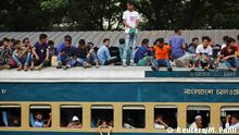 People board atop an overcrowded passenger train as they travel home to celebrate Eid al-Adha festival at a railway station in Dhaka, Bangladesh, August 10, 2019. REUTERS/Mohammad Ponir Hossain