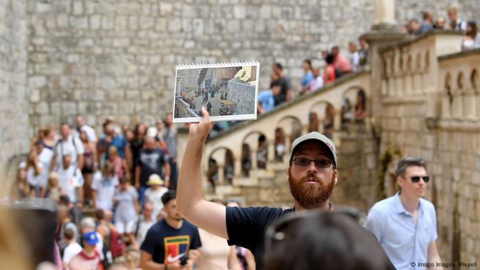 Groups of people take part in a Game of Thrones tour through Dubrovnik, Croatia
