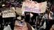 Female protesters holding signs Female protesters holding signs