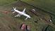 Bird's-eye view of a Ural Airlines plane sitting in a field after making an emergency landing Bird's-eye view of a Ural Airlines plane sitting in a field after making an emergency landing