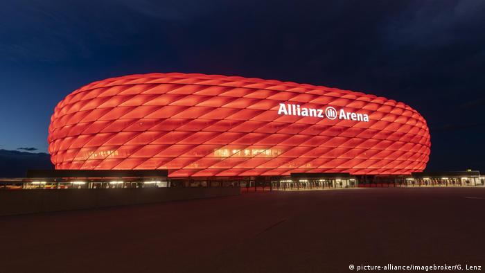 Allianz Arena from outside lit up in red