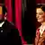 Filmstill Und der Zukunft zugewandt Szene mit Mann und Frau vor rotem Vorhang