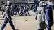 Zimbabwean Police beat up protester Zimbabwean Police beat up protester