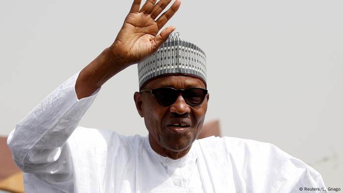 Nigeria's President Muhammadu Buhari greets his supporters after Friday prayers in his hometown Daura