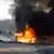 A burning car following a bomb attack