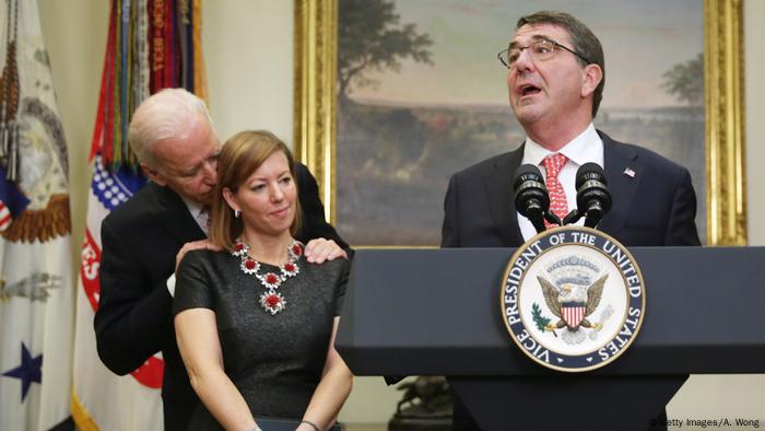 Former Vice President Joe Biden standing behind the wife of Ash Carter as he is sworn in