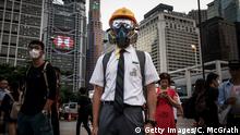 HONG KONG - AUGUST 22: A student wears protective equipment with his school uniform during an anti- government student rally on August 22, 2019 in Hong Kong, China. The students gathered to support the ongoing protest movement and discussed the planned September student strike. Pro-democracy protesters have continued rallies on the streets of Hong Kong against a controversial extradition bill since 9 June as the city plunged into crisis after waves of demonstrations and several violent clashes. Hong Kong's Chief Executive Carrie Lam apologized for introducing the bill and declared it dead, however protesters have continued to draw large crowds with demands for Lam's resignation and complete withdrawal of the bill. (Photo by Chris McGrath/Getty Images)
