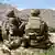 US soldiers look out over hillsides during a visit of the commander of US and NATO forces in Afghanista