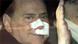 Italian Prime Minister Silvio Berlusconi sitting in his car, with wounds on his face Italian Prime Minister Silvio Berlusconi sitting in his car, with wounds on his face