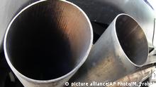 FILE - In this Wednesday, Aug. 2, 2017 file photo, the exhaust pipes of a VW Diesel car are photographed in Frankfurt, Germany. The European Union's anti-trust watchdog is investigating whether automakers BMW, Daimler and Volkswagen colluded to limit the development and roll-out of car emission control systems, it was reported on Tuesday, Sept. 18, 2018. (AP Photo/Michael Probst, File) |