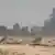 Smoke billows from an Aramco oil facility in Abquaiq following drone attacks