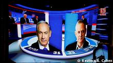 The results of the exit polls are shown on a screen at Benny Gantz's Blue and White party headquarters, following Israel's parliamentary election, in Tel Aviv, Israel, September 17, 2019. REUTERS/Amir Cohen