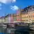 Nyhavn canal in Copenhagen, with colorful houses and boats