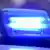 Синий проблесковый маячок на автомобиле полиции