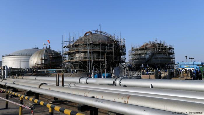  Workers at the damaged site of the Saudi Aramco oil facility in Abqaiq