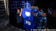 KABUL - SEPTEMBER 23 : Afghan workers move ballot boxes to trucks getting ready for the Presidential elections in five days on September 23, 2019 in Kabul, Afghanistan. Afghanistan is struggling with unrelenting violence and a very high death toll for August as Afghans question whether it is work showing up to vote in the Presidential elections. President Trump cancelled peace negotiations with the Taliban with a possible return to the talks still unclear after 18 years of war confusion and chaos to a solution remains. The US state department also cut $100 million in aid this week.
(Photo by Paula Bronstein/Getty Images )