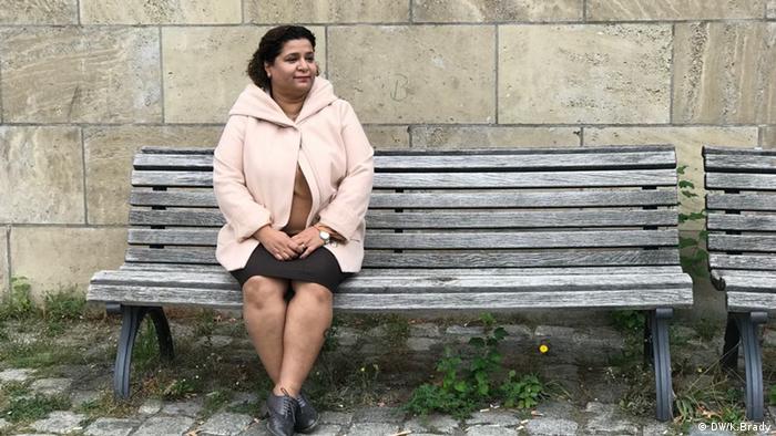 Suha Basharen sits on a bench in Berlin