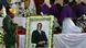 Soldiers stand beside a picture of former Zimbabwean President Robert Mugabe during a church service before his burial Soldiers stand beside a picture of former Zimbabwean President Robert Mugabe during a church service before his burial
