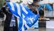 A man waving the flag of 'Ambazonia' A man waving the flag of 'Ambazonia'