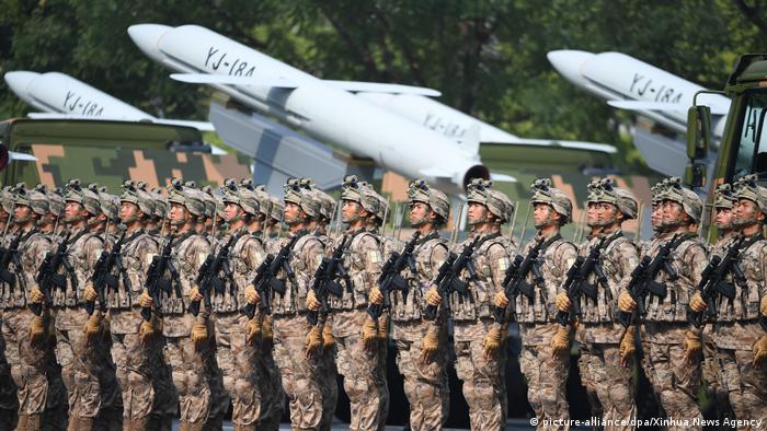 Soldiers stand for a military parade in Beijing