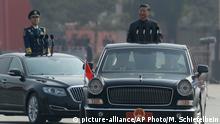 Chinese leader Xi Jinping rides in an open-top limousine during a parade to mark the 70th anniversary of the founding of Communist China, in Beijing, Tuesday, Oct. 1, 2019. (AP Photo/Mark Schiefelbein)