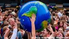 TOPSHOT - Protesters throw an earth-shaped ball during the Global Strike For Future demonstration in Stockholm on May 24, 2019, a global day of student protests aiming to spark world leaders into action on climate change. - In a shift since the last European Parliament elections, mainstream parties have adopted climate change as a rallying cry -- spurred in part by a wave of student strikes. A Eurobarometer poll shows climate change is now a leading concern for European Union voters, not far behind economic issues and rivalling worries about migration. (Photo by Jonathan NACKSTRAND / AFP) (Photo credit should read JONATHAN NACKSTRAND/AFP/Getty Images)