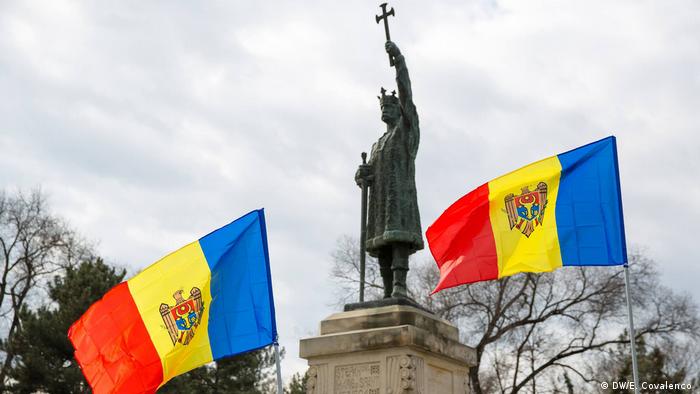 Moldavian flags near a statue