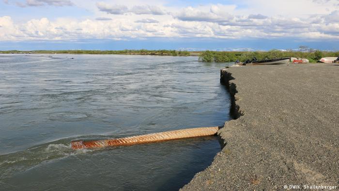 The Kanektok River eats away at a road in Quinhagak