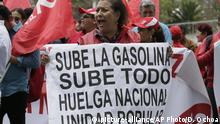 A woman holds a sing that reads in Spanish “Gasoline goes up. Everything goes up. National strike. Popular unity” during a protest against the elimination of fuel subsidies, outside the Finance Ministry building in Quito, Ecuador, Wednesday, Oct. 2, 2019. Ecuadorian President Lenin Moreno announced an end to government subsidies for holding down fuel prices and said Tuesday night that he will send congress a proposal to overhaul taxes and labor rules as a way to revitalize the economy. (AP Photo/Dolores Ochoa). |