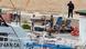 Coffins containing the bodies of refugees drowned at sea in Lampedusa Harbor in Italy Coffins containing the bodies of refugees drowned at sea in Lampedusa Harbor in Italy