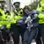 Policija privodi jednu od učesnica blokade saobraćaja u Londonu