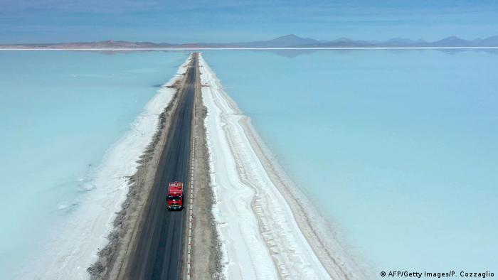 Aerial view of a truck on a road crossing the flooded southern zone of the Uyuni Salt Flat