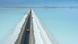 Aerial view of a truck on a road crossing the flooded southern zone of the Uyuni Salt Flat Aerial view of a truck on a road crossing the flooded southern zone of the Uyuni Salt Flat