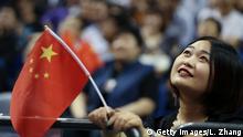 SHANGHAI, CHINA - OCTOBER 10: A Chinese fans waves a Chinese flag during a preseason game between the Los Angeles Lakers and Brooklyn Nets as part of 2019 NBA Global Games China at Mercedes-Benz Arena on October 10, 2019 in Shanghai, China. (Photo by Lintao Zhang/Getty Images)